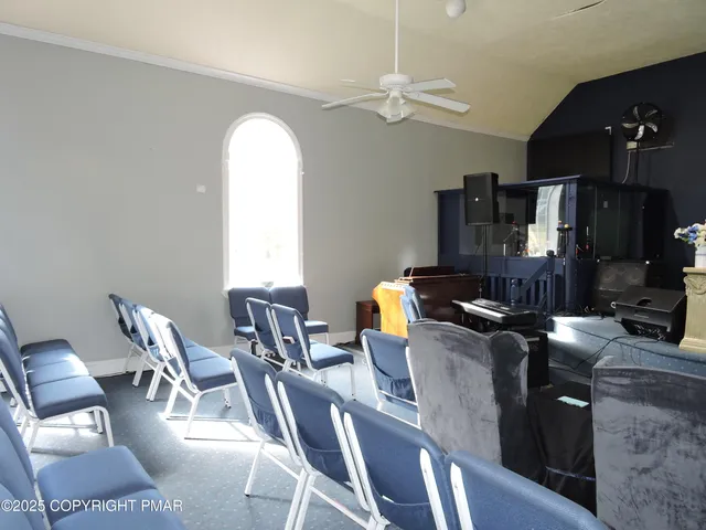 a dining room with furniture and chandelier