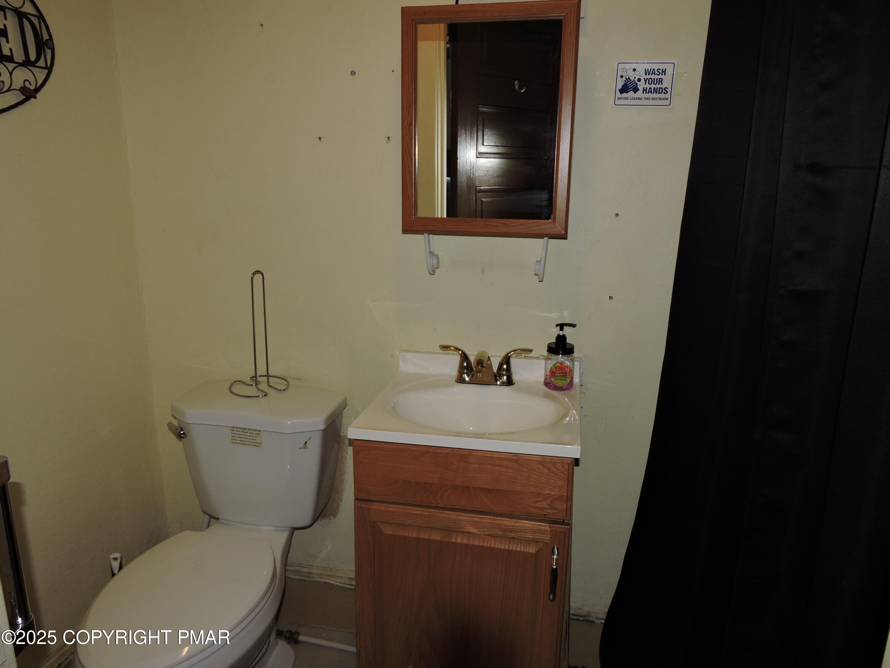 200 Frost Hollow Road Easton, PA 18040 - Photo 5 of 5 a bathroom with a toilet sink and mirror