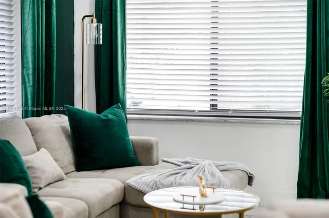 a living room with furniture potted plant and a potted plant