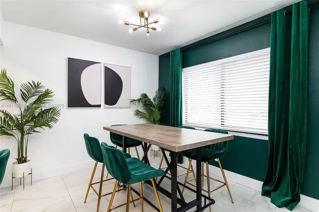 a view of a room with furniture and window