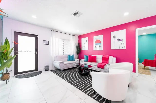 a living room with kitchen furniture and a kitchen view
