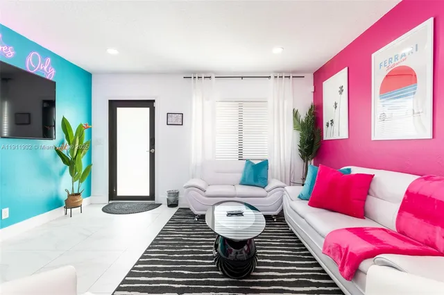 a living room with furniture and a rug