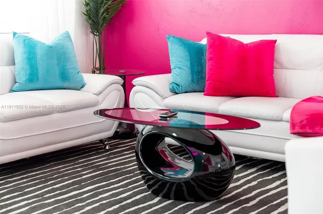 a view of a dining room with furniture and a window