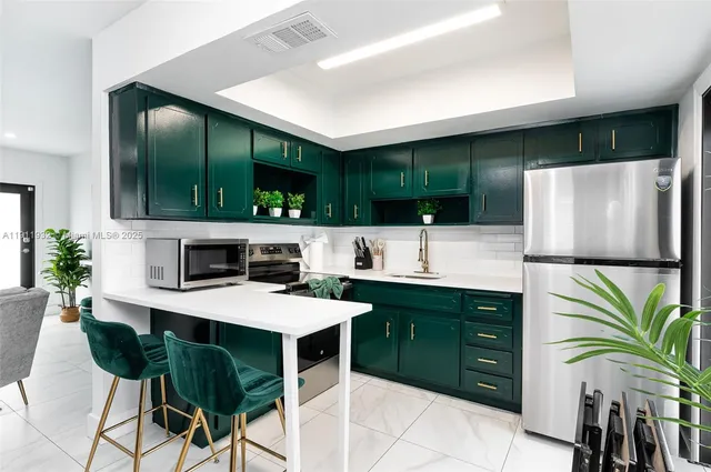 a kitchen with a table and chairs in it