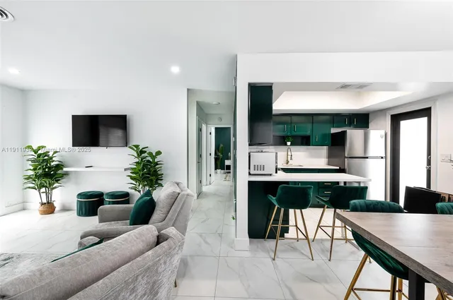 a living room with furniture a large window and a table