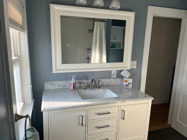 a bathroom with a sink and a mirror