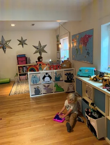 a spacious bedroom with a bed and a window