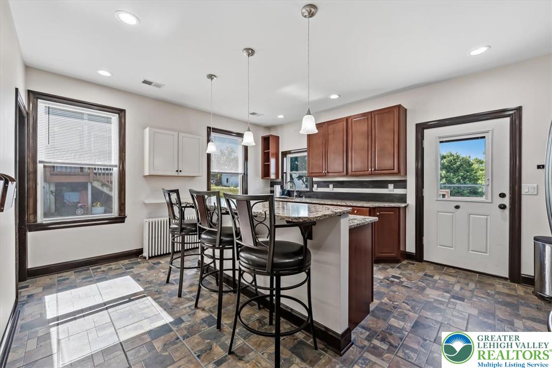 3453 Main Street Slatington, PA 18080 - Photo 5 of 30 A functional kitchen boasts ample counter space with a casual dining island, ideal for everyday meals.