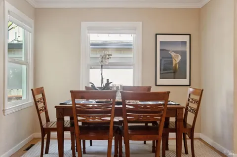 a view of a dining room with furniture window and outside view