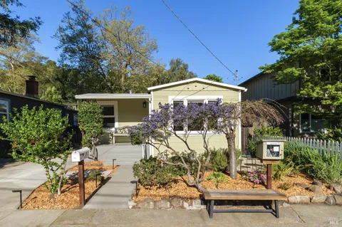 a view of a backyard with a patio