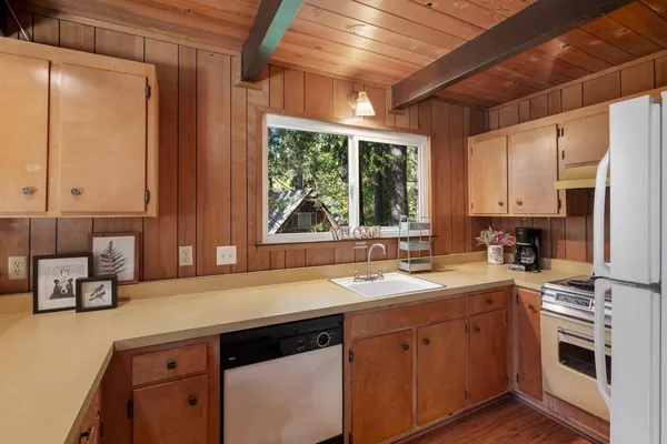 a kitchen with a sink stove and microwave