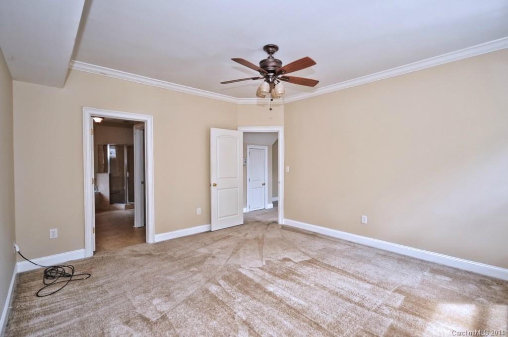 901 McAlway Road Charlotte, NC 28211 - Photo 14 of 24 a view of a hallway with a chandelier fan