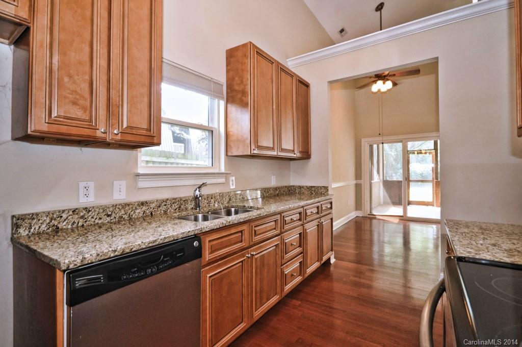 901 McAlway Road Charlotte, NC 28211 - Photo 4 of 24 a kitchen with stainless steel appliances granite countertop a sink stove and cabinets