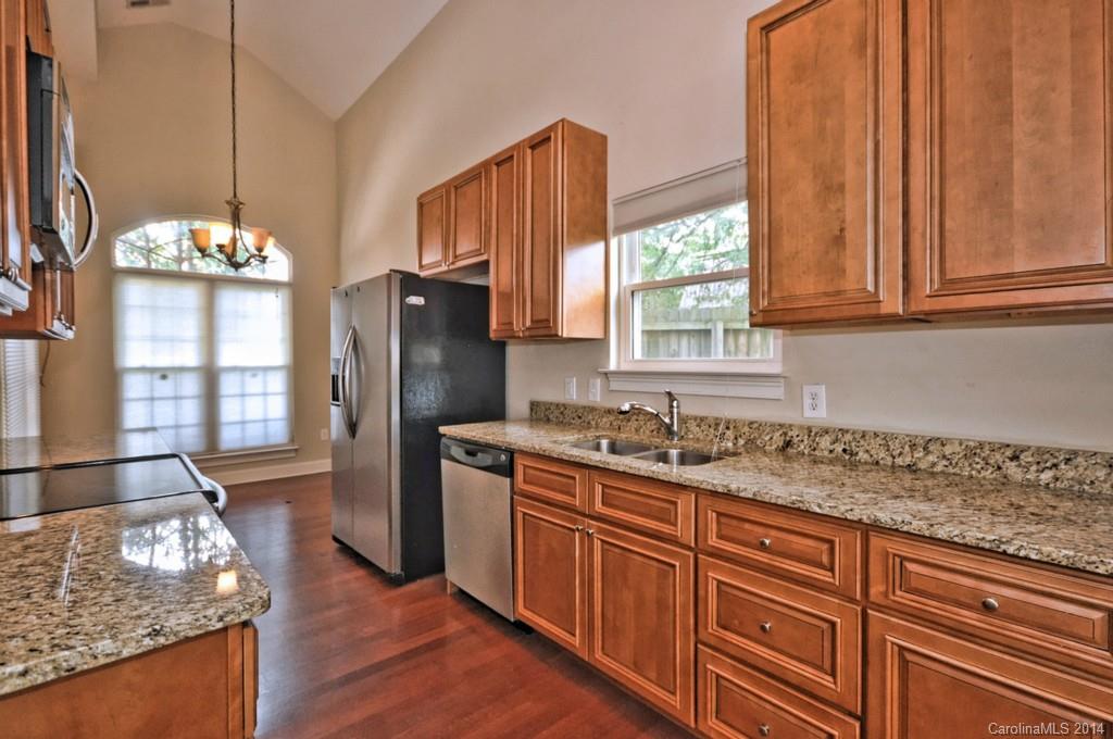 901 McAlway Road Charlotte, NC 28211 - Photo 6 of 24 a kitchen with granite countertop a sink stainless steel appliances and cabinets