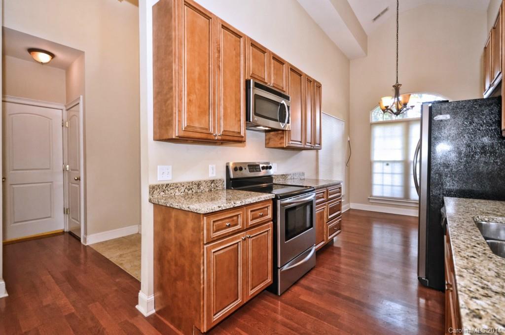 901 McAlway Road Charlotte, NC 28211 - Photo 7 of 24 a kitchen with stainless steel appliances granite countertop a stove a sink and a refrigerator