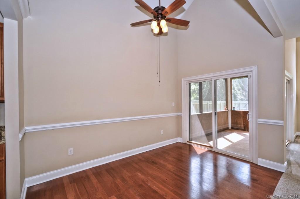 901 McAlway Road Charlotte, NC 28211 - Photo 8 of 24 a view of an empty room with a window and wooden floor