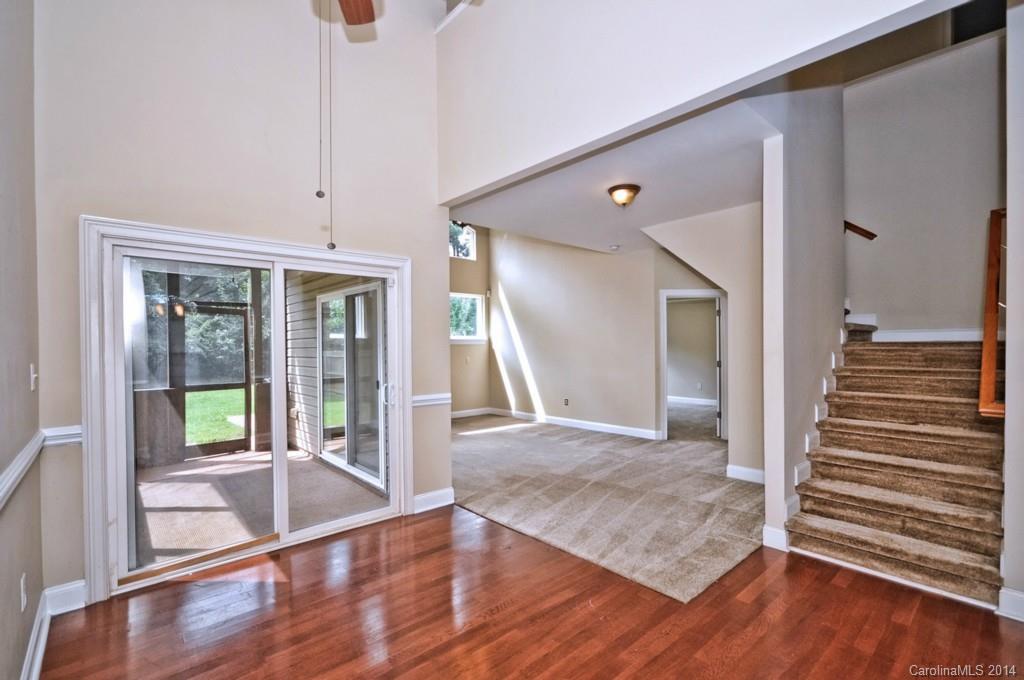 901 McAlway Road Charlotte, NC 28211 - Photo 9 of 24 a view of a hallway view with wooden floor and staircase