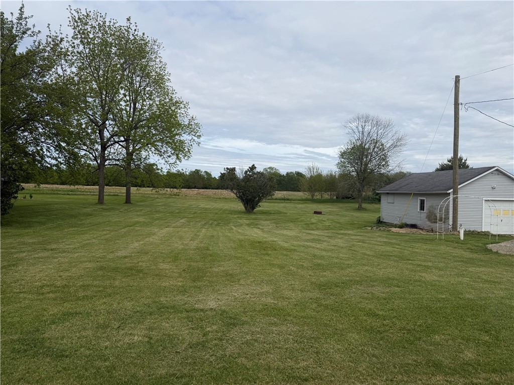 3032 West State Rte 29 Urbana, OH 43078 - Photo 3 of 3 Expansive green lawn extends to the horizon, offering serene outdoor living space.