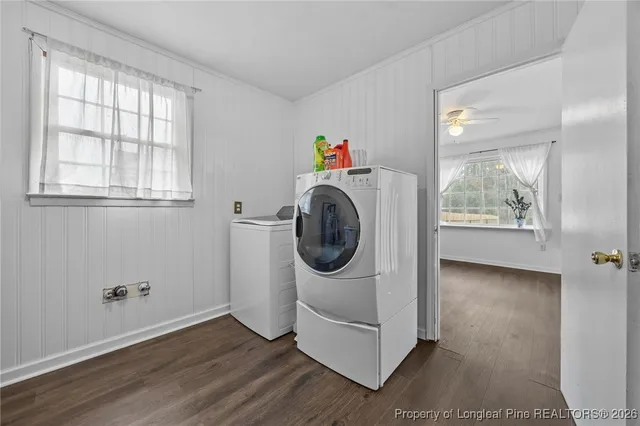 a utility room with closet dryer and washer
