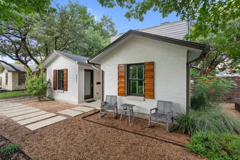 a front view of house with yard and seating area