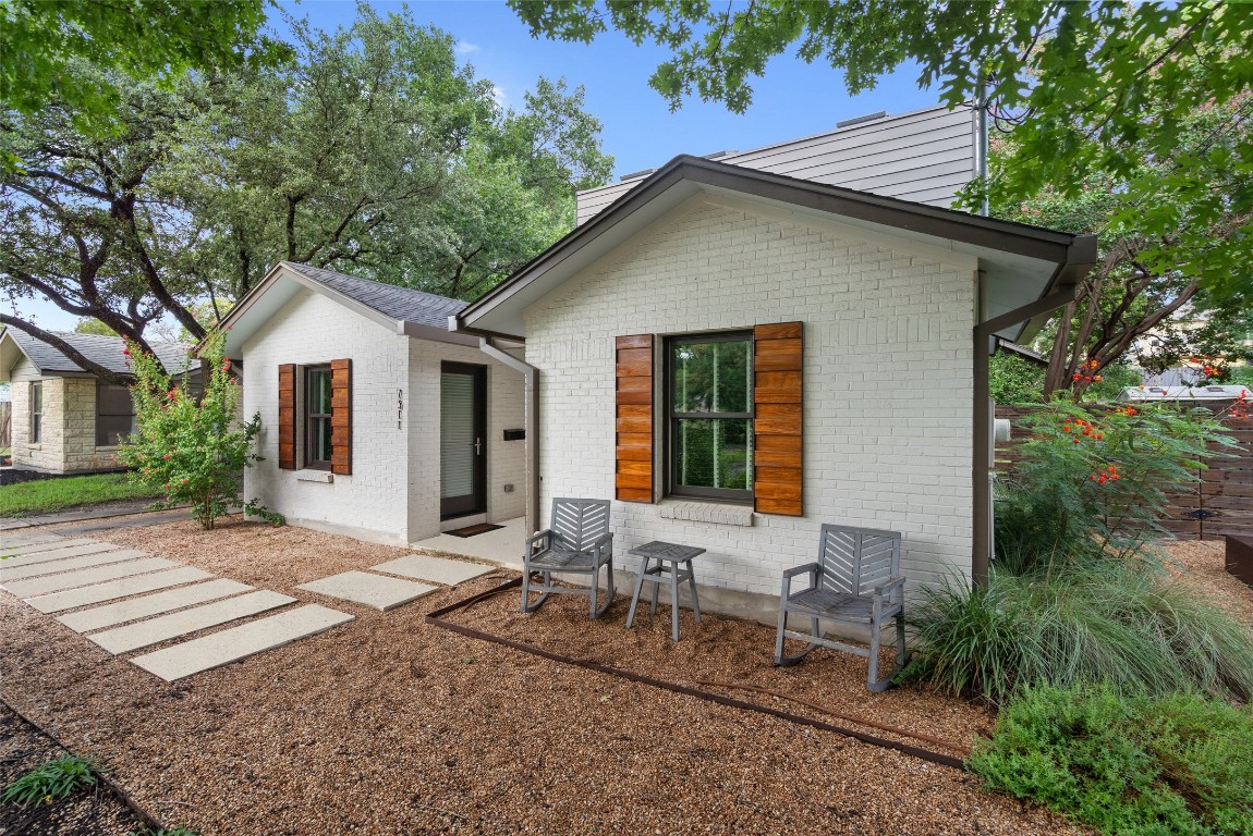 a front view of house with yard and seating area