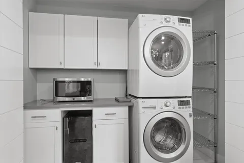 a workspace with wooden floor and a window