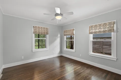 a bathroom with a sink toilet and a mirror
