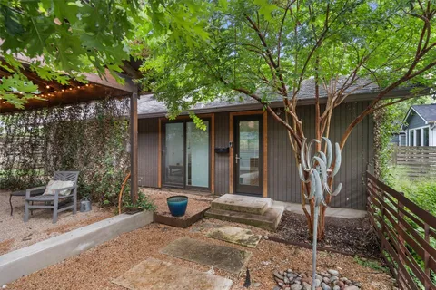 a living room with fireplace furniture and a flat screen tv