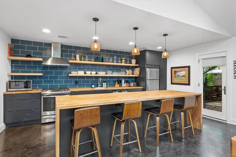 a kitchen with a sink and a stove