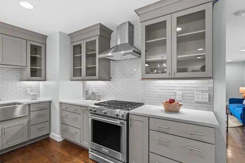 a white refrigerator freezer and a potted plant in a kitchen