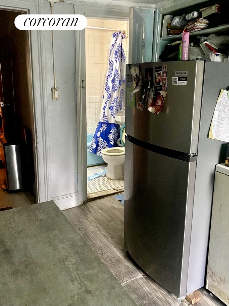 116 4th Avenue Brooklyn, NY 11217 - Photo 15 of 17 a view of a refrigerator in kitchen and an empty room