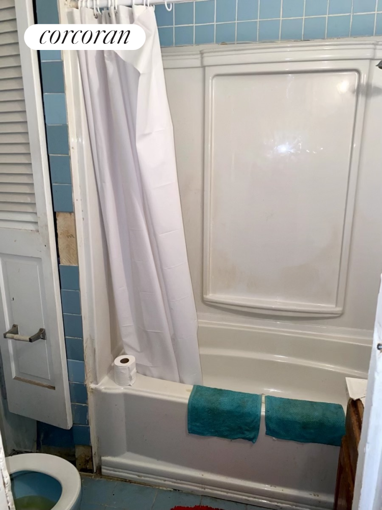 116 4th Avenue Brooklyn, NY 11217 - Photo 16 of 17 a bathroom with a bathtub and a toilet