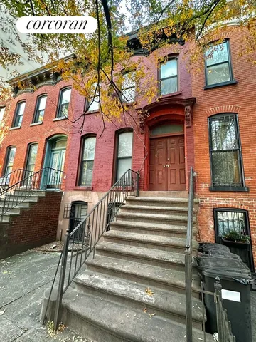 a view of a brick building with many windows