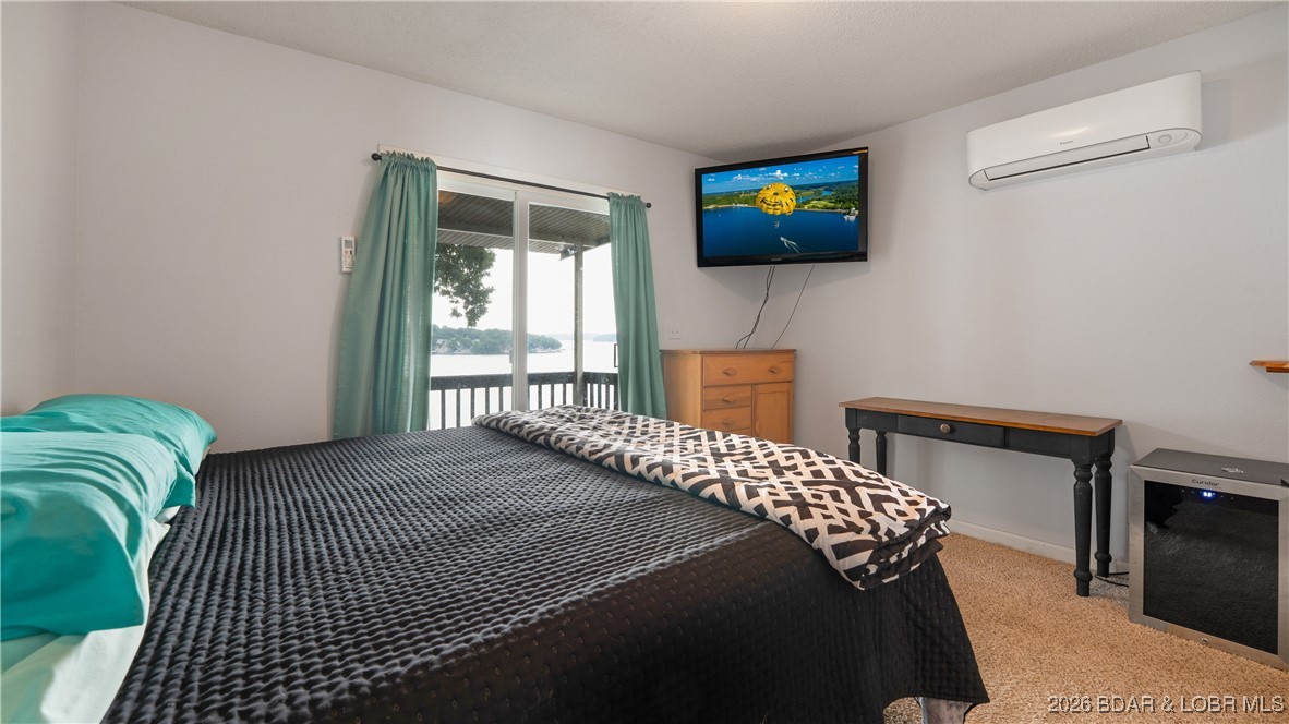 2859 Twin Rivers Point Camdenton, MO 65020 - Photo 14 of 30 Master Bedroom with beautiful lake view, and slide