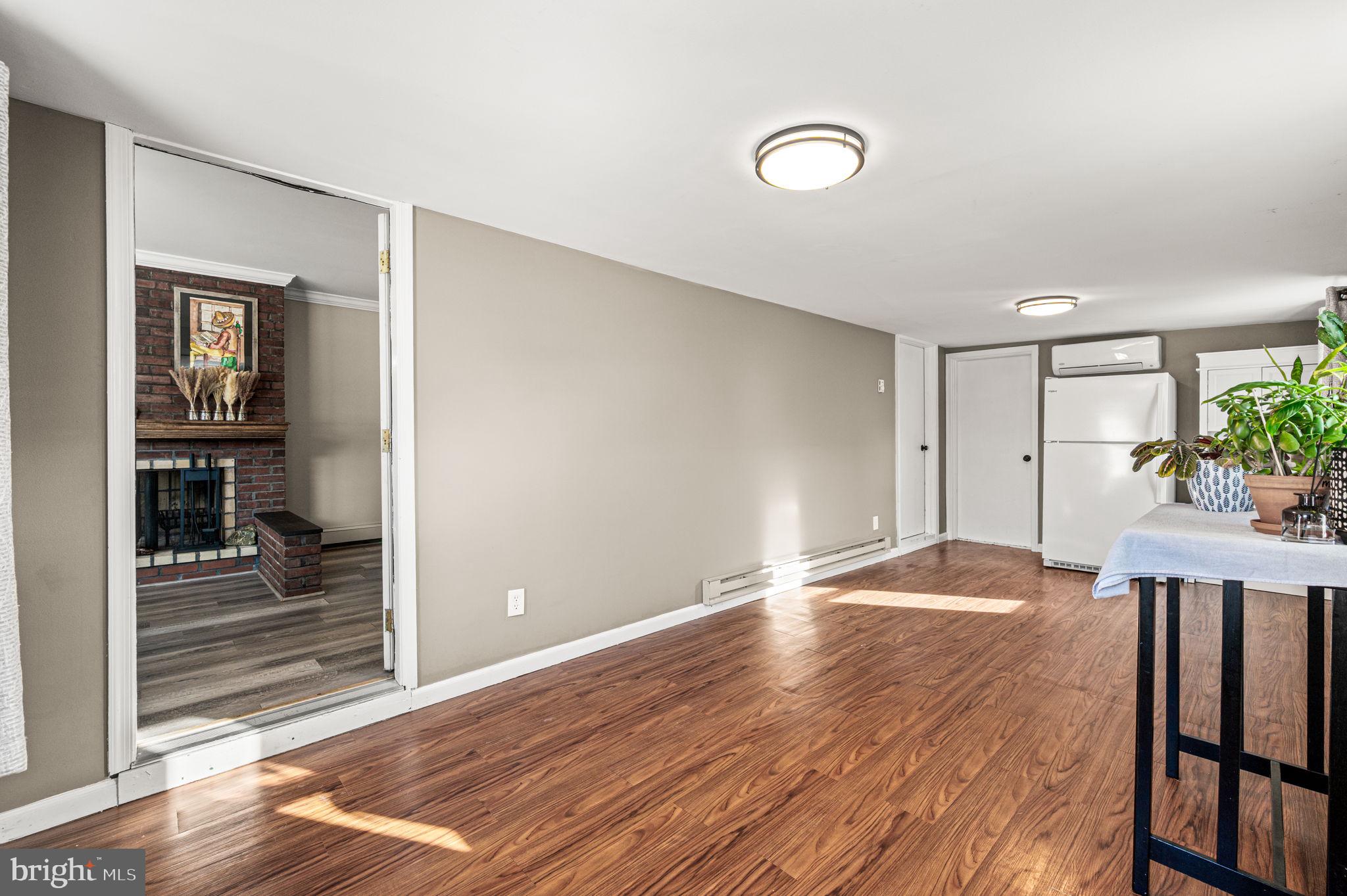 29 Spindletree Road Levittown, PA 19056 - Photo 11 of 29 a view of empty room with wooden floor