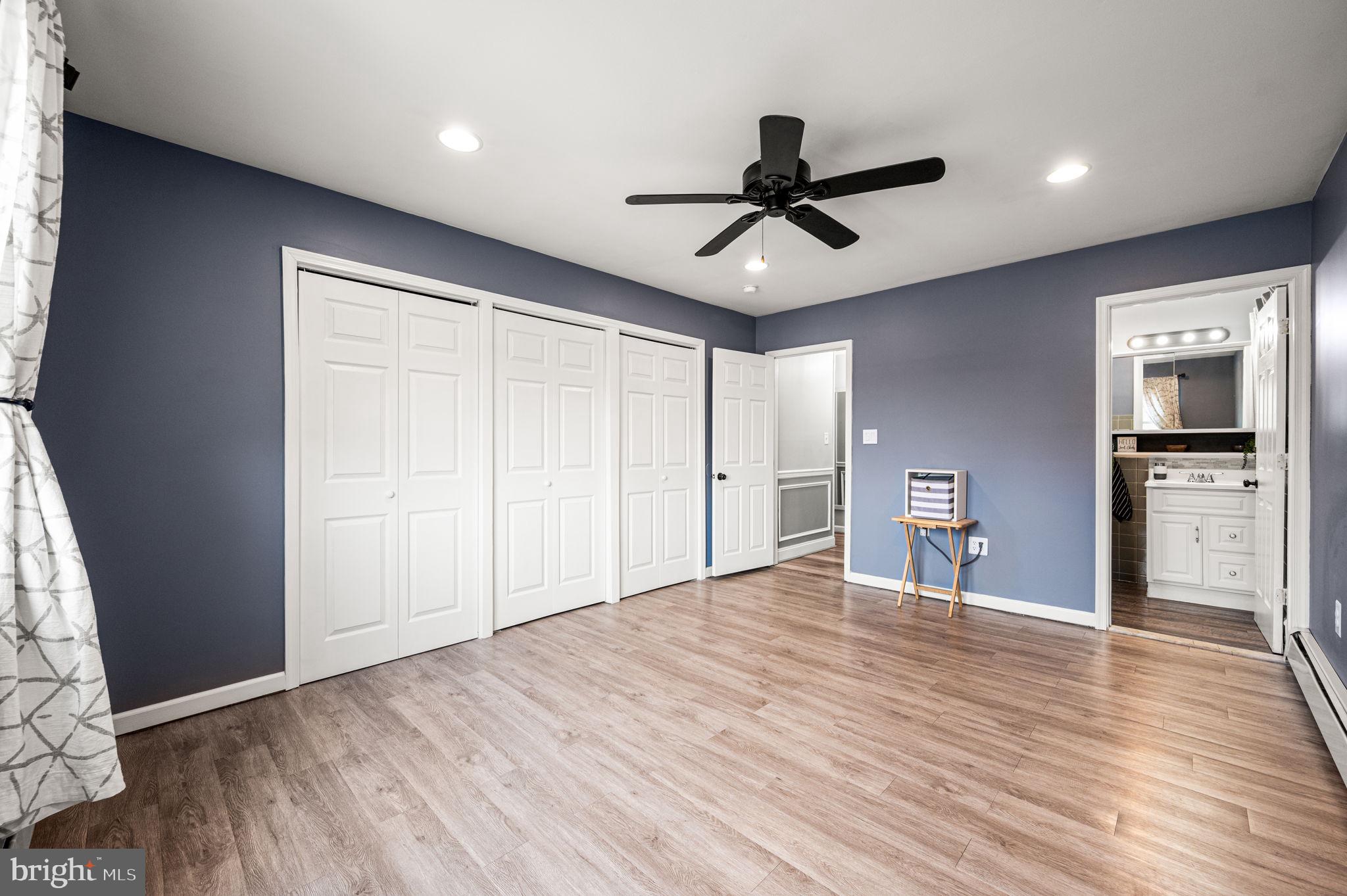 29 Spindletree Road Levittown, PA 19056 - Photo 14 of 29 a view of empty room with wooden floor and window