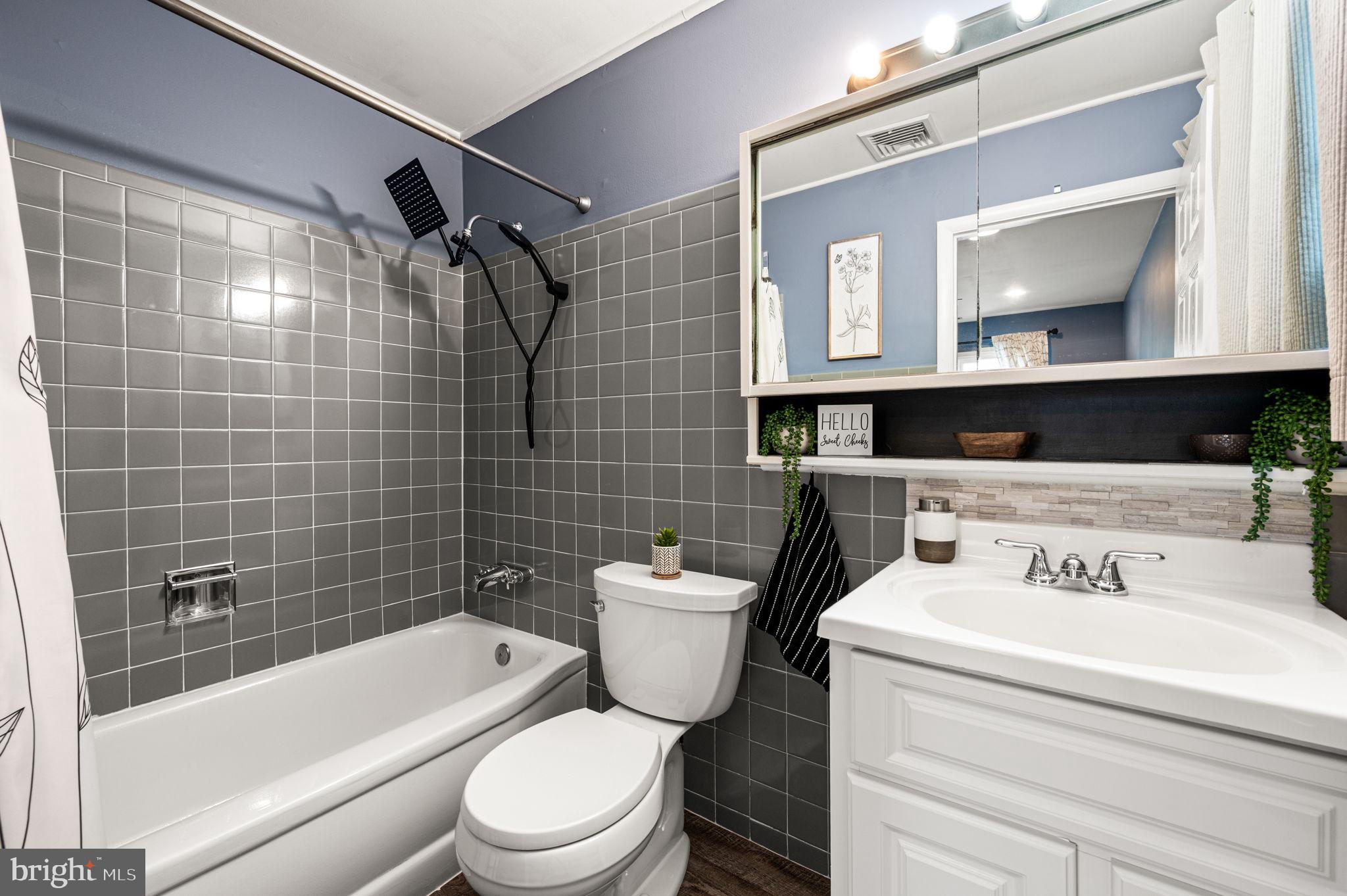 29 Spindletree Road Levittown, PA 19056 - Photo 15 of 29 a bathroom with a toilet a sink and bathtub