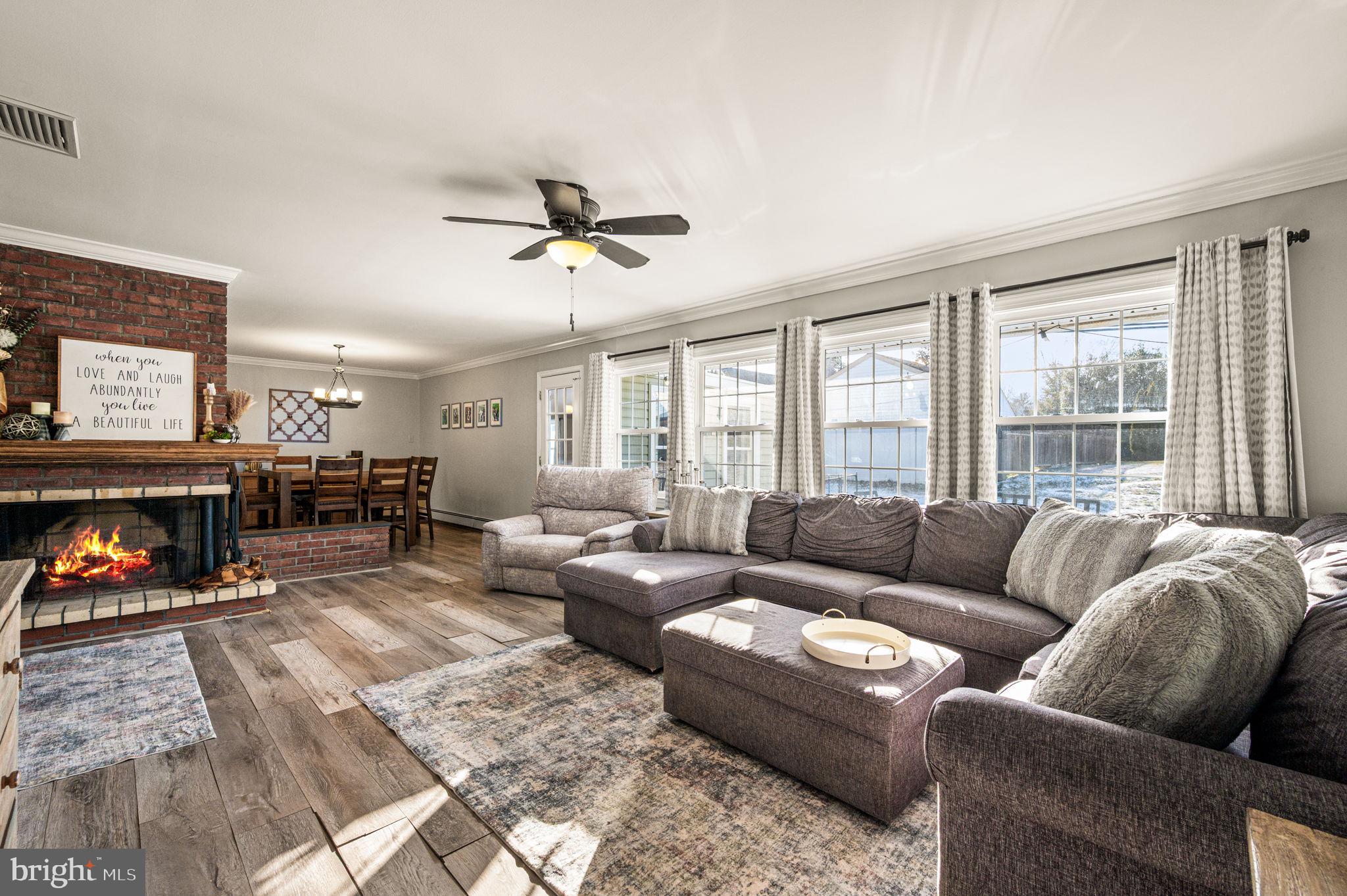 29 Spindletree Road Levittown, PA 19056 - Photo 6 of 29 a living room with furniture fireplace and a large window