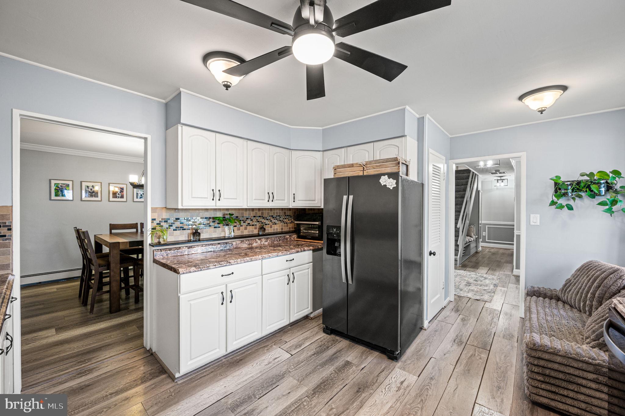 29 Spindletree Road Levittown, PA 19056 - Photo 8 of 29 a kitchen with a center island wooden floor and stainless steel appliances