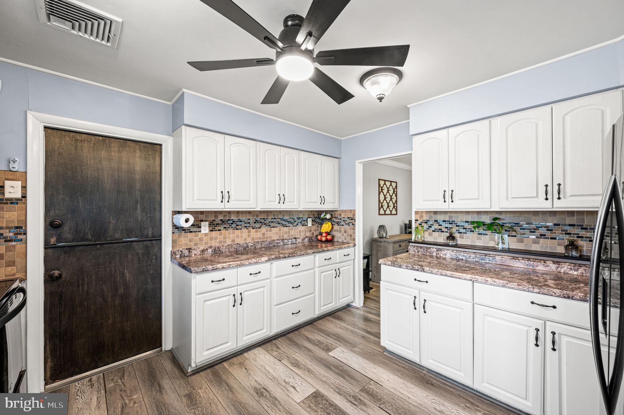 29 Spindletree Road Levittown, PA 19056 - Photo 10 of 29 a kitchen with a refrigerator a sink and cabinets