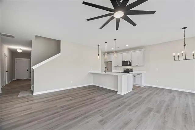 a view of kitchen with sink and wooden floor