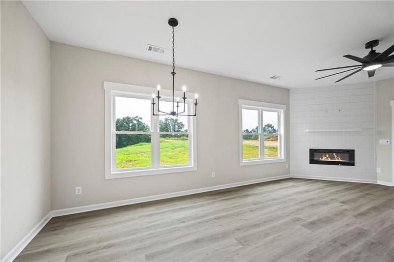 613 Racetrack Road Toccoa, GA 30577 - Photo 17 of 47 a view of an empty room with a window and wooden floor