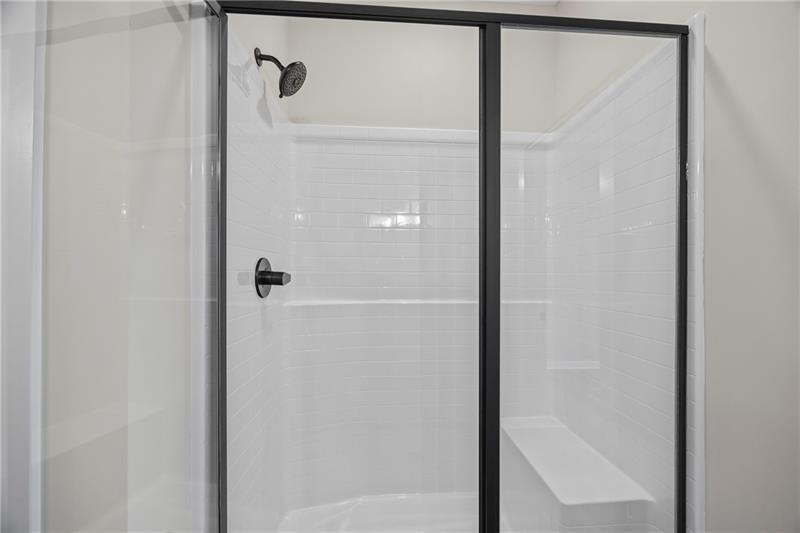 613 Racetrack Road Toccoa, GA 30577 - Photo 31 of 47 a bathroom with a glass shower door