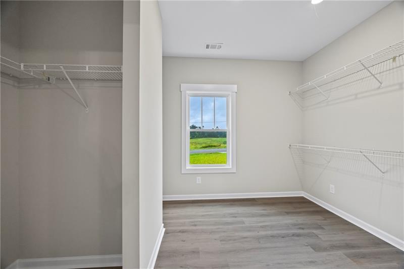 613 Racetrack Road Toccoa, GA 30577 - Photo 32 of 47 a view of an empty room with a window and wooden floor
