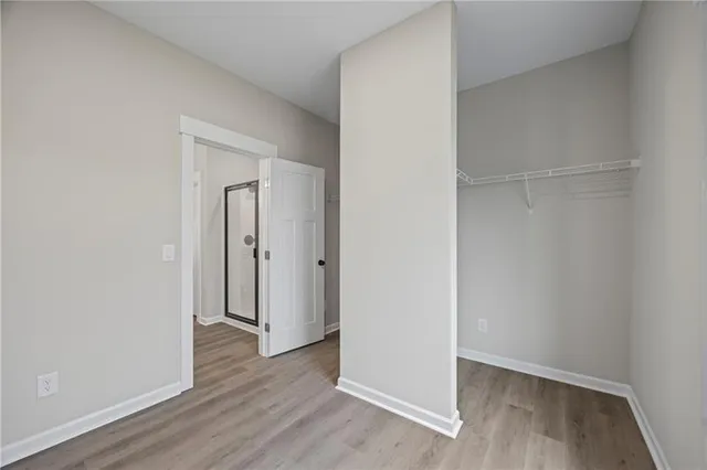 a view of hallway with wooden floor