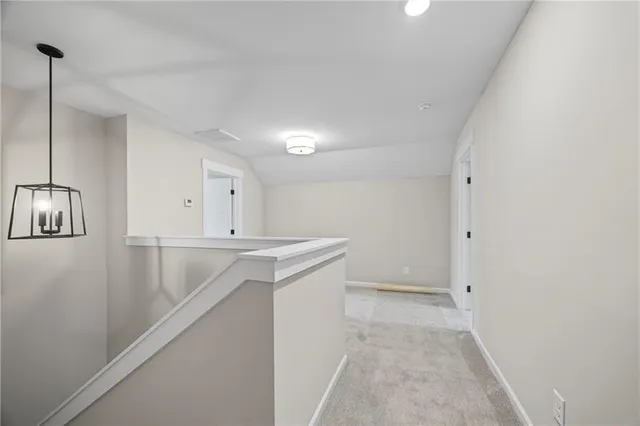 a view of storage and utility room with empty racks