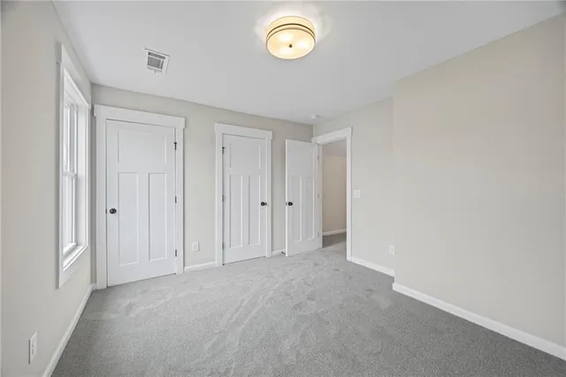 a view of an empty room and a window