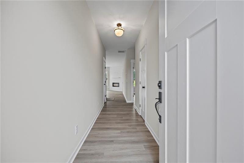 613 Racetrack Road Toccoa, GA 30577 - Photo 5 of 47 a view of a hallway with wooden floor and staircase