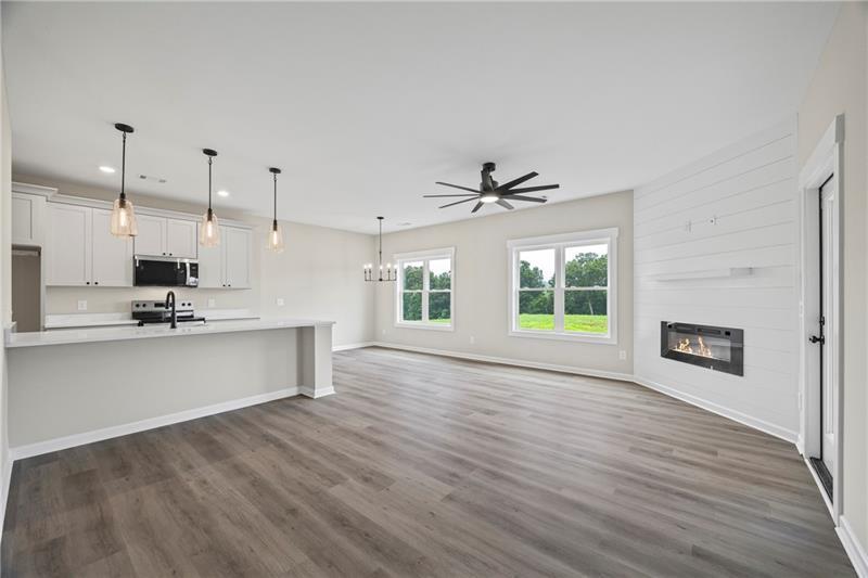 613 Racetrack Road Toccoa, GA 30577 - Photo 9 of 47 a view of an empty room with window and wooden floor