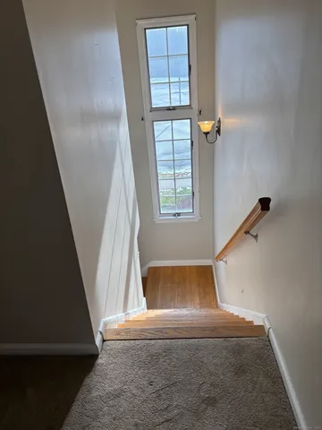 a view of entryway with wooden floor